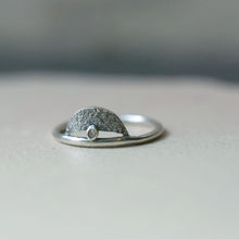 Load image into Gallery viewer, A beautiful and unusual champagne diamond ring. Made in recycled sterling silver with an organic texture. The diamond sits on top of the silver band with a crescent moon shape above it.